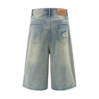 Light blue denim shorts with a brand label on a white background