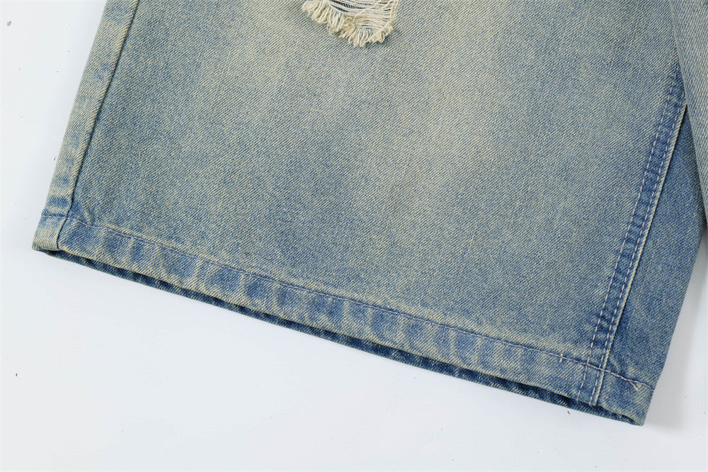Close-up of a folded blue denim fabric on a white background