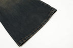 Close-up of dark denim fabric on a white background