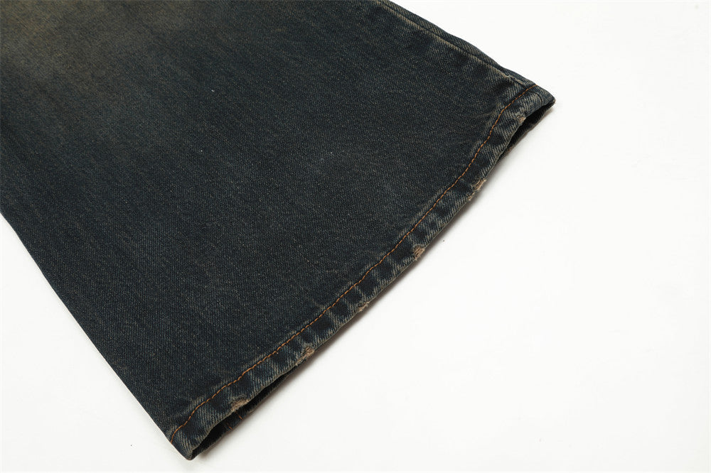 Close-up of dark denim fabric on a white background