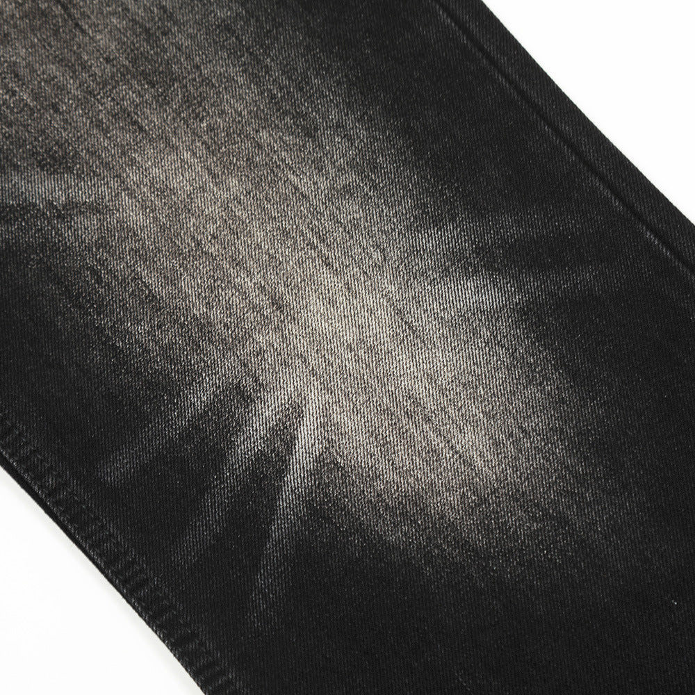 Close-up of black denim fabric with visible texture