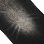 Close-up of black denim fabric with visible texture