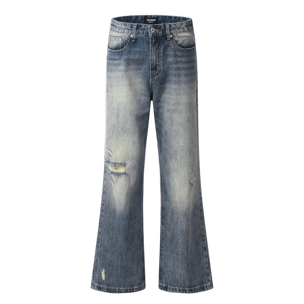 Blue jeans with slight distressing on a white background