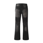Black distressed jeans on a white background