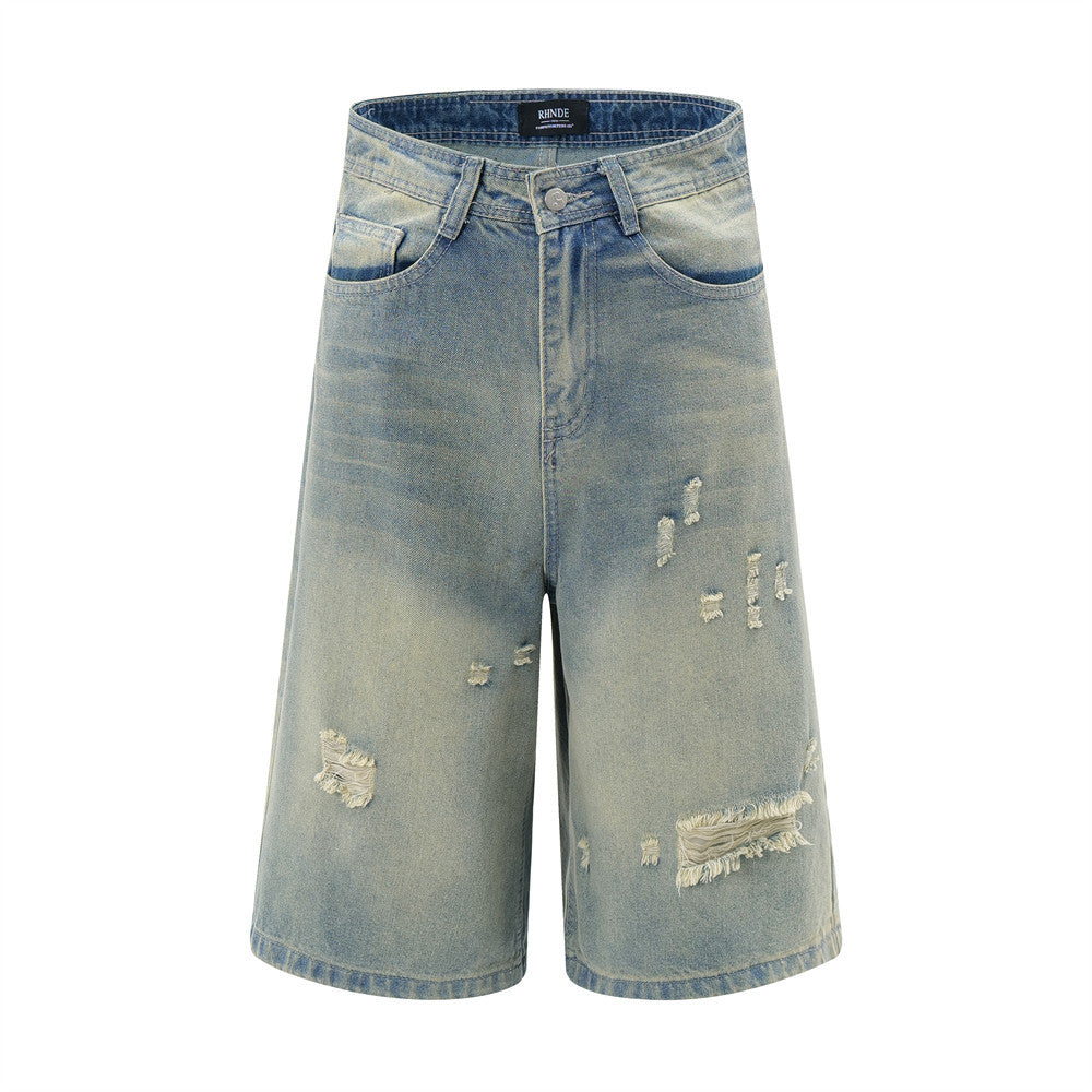 Distressed denim shorts on a white background